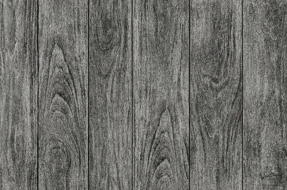 Wide planks in weathered charcoal grey, with knots and strong grain showing through.