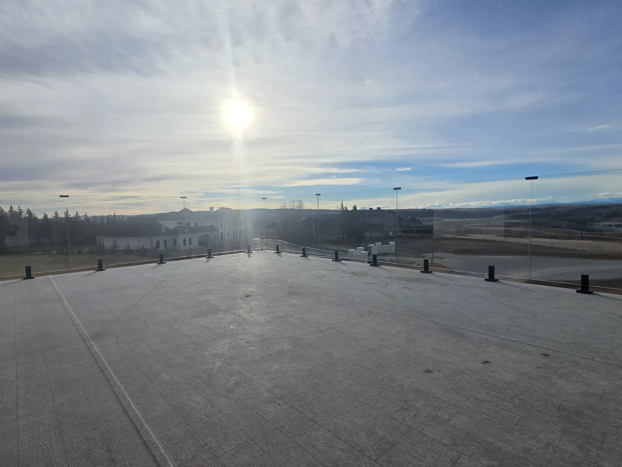 A wide granite vinyl deck opening onto the prairie horizon